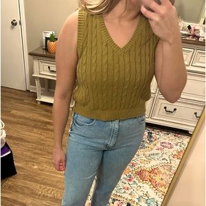 mustard/green sweater vest.